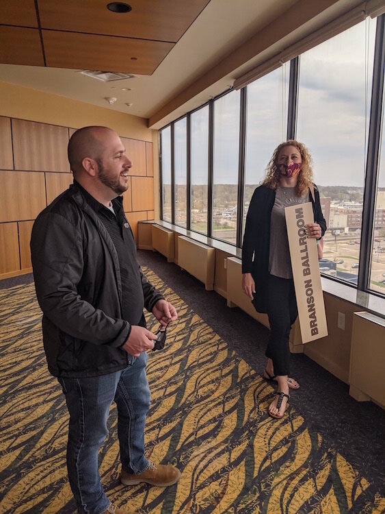 Joe Sobieralski, President and CEO of Battle Creek Unlimited, at left, and Sara Wallace, President and CEO of the Miller Foundation, take in the view from a room on the 16th floor of the hotel.  Wallace was there in early April to retrieve a sign.