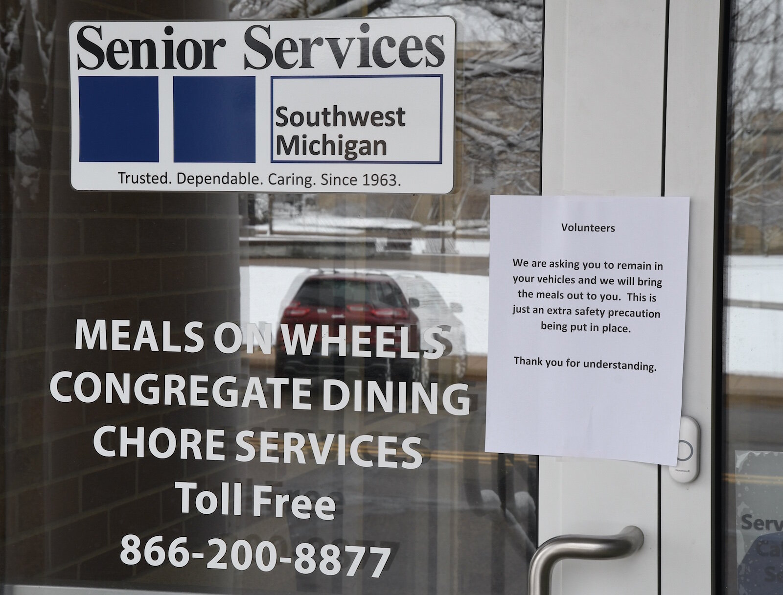 Sign on the door to Senior Services at the Kool Center in downtown Battle Creek.