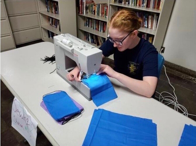 Michigan Youth Challenge Academy Cadet Maddison Shirey sews cloth masks to be donated to facilities in the surrounding Battle Creek community on Wednesday, April 8