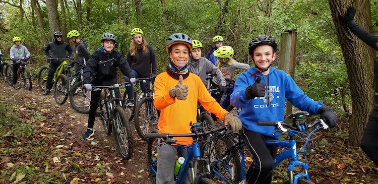 In a pre-COVID activity, Portage Central Middle School students learn Wearing a helmet, rules of the road, maintenance, basic pedaling as they improve their mental focus.