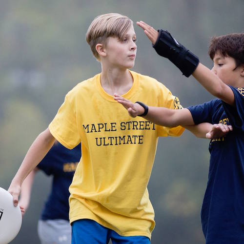 Miles Warmelink looks for a clear pass. Photo by Kimberly Moss 