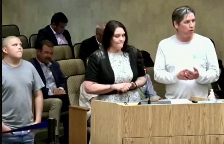 Mark Lee, head of Better World Builders, right, explains to members of the Kalamazoo, County Board off Commissioners the positive impact of the home insulation work that his company is doing to help residents of Galesburg.