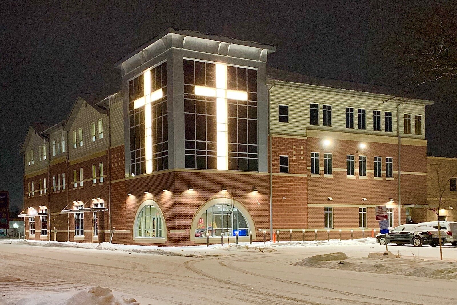Huge crosses mark the new women and children’s shelter on the downtown campus of the Kalamazoo Gospel Mission.