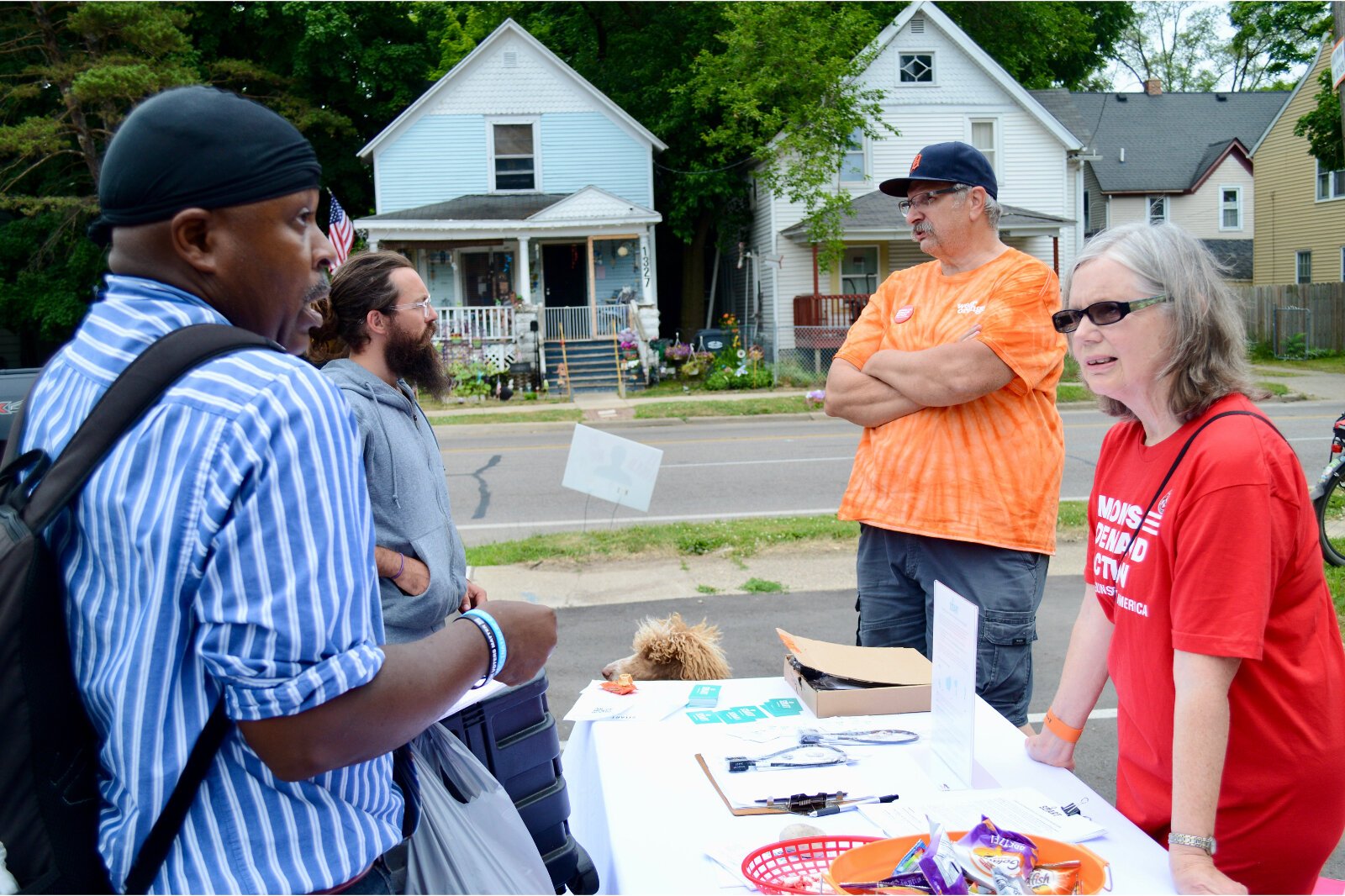 Alphonso Harris, left, a Northside resident who ran for Kalamazoo City Commission in 2021, speaks with a member of Kalamazoo Moms Demand Action. "Kalamazoo should not have this big gun problem. It's insane to me. We're not Chicago, we're not Detroit,