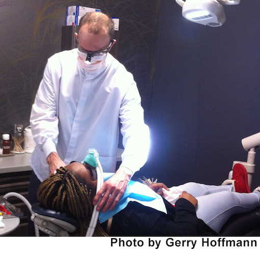 Kevin Morse performs a dental procedure at the Dental Day of Caring.