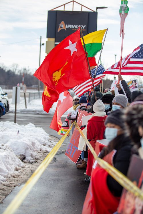 The Battle Creek Burmese community group held up signs and chanted as the President’s motorcade made its way from the Kalamazoo/Battle Creek International Airport to the Pfizer facility on Portage Road.