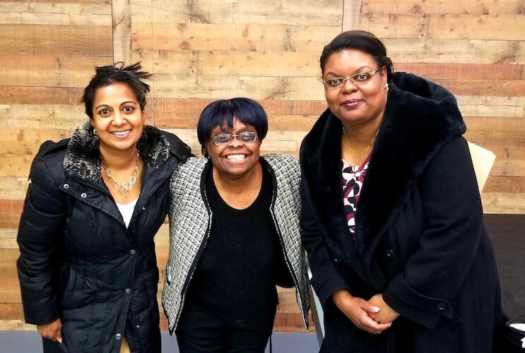 NACD Executive Director Mattie Jordan-Woods stands with Sonali Allen, of  Mercantile Bank, and Angela Durrah-Bays, of Horizon Bank, during a “How to Start a Business” class during the winter of 2018.