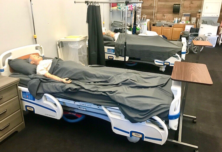 Students in the certified nursing assistant program, hosted by NACD in collaboration with other organizations, use equipment provided by Stryker Corp. and others in their classwork.