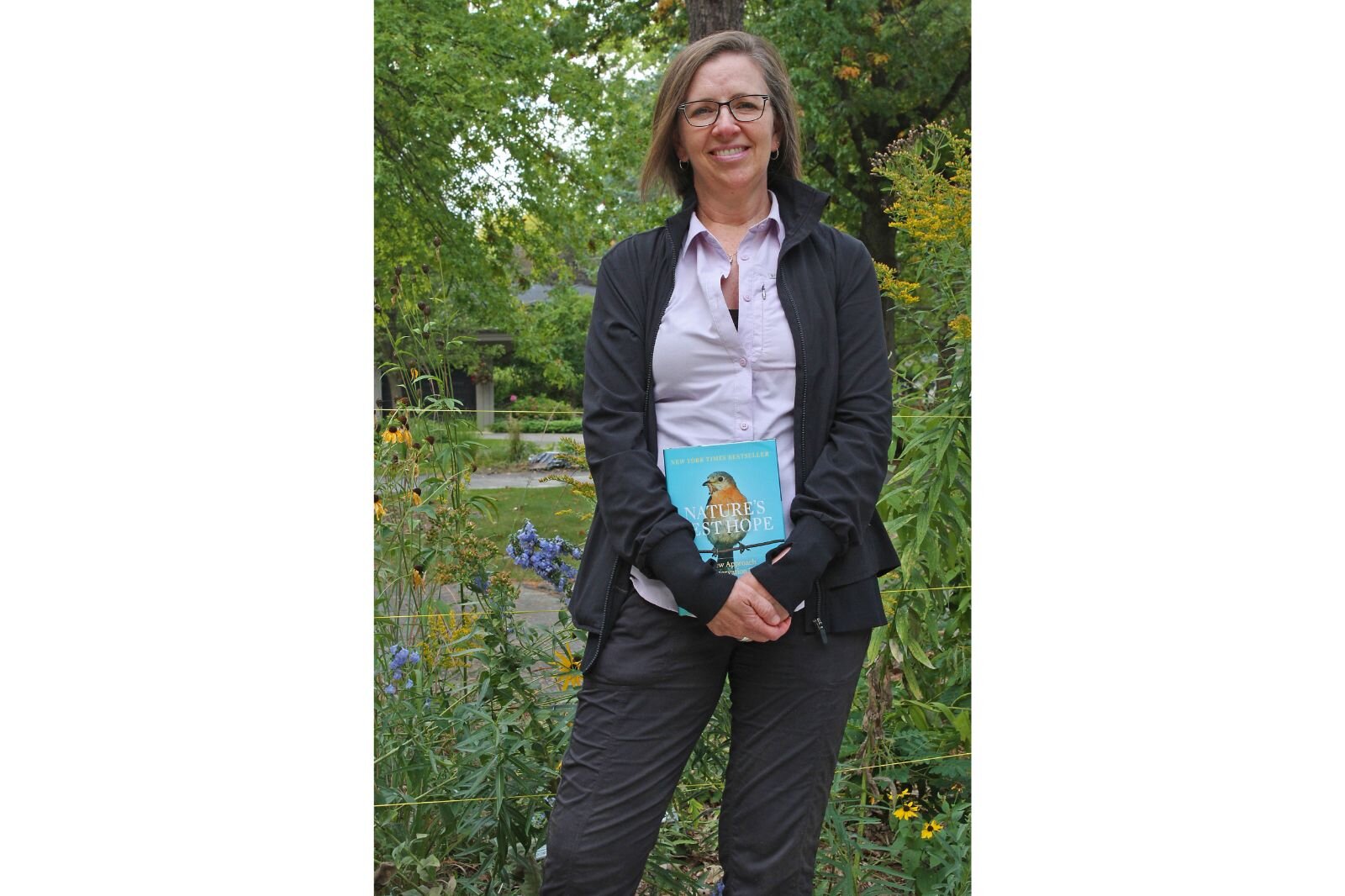 Donna Perry Keller holds a copy of “Nature’s Best Hope.”