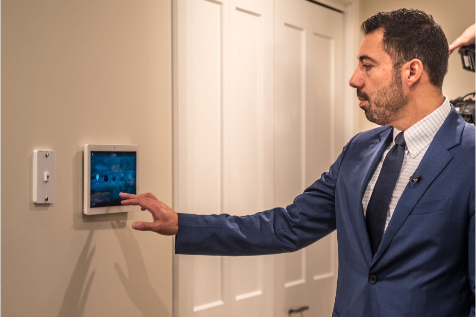 Jay Prince, President and CEO of Heritage Community of Kalamazoo, is shown demonstrating a home automation system that allows residents of Revel Creek to adjust their living environments.