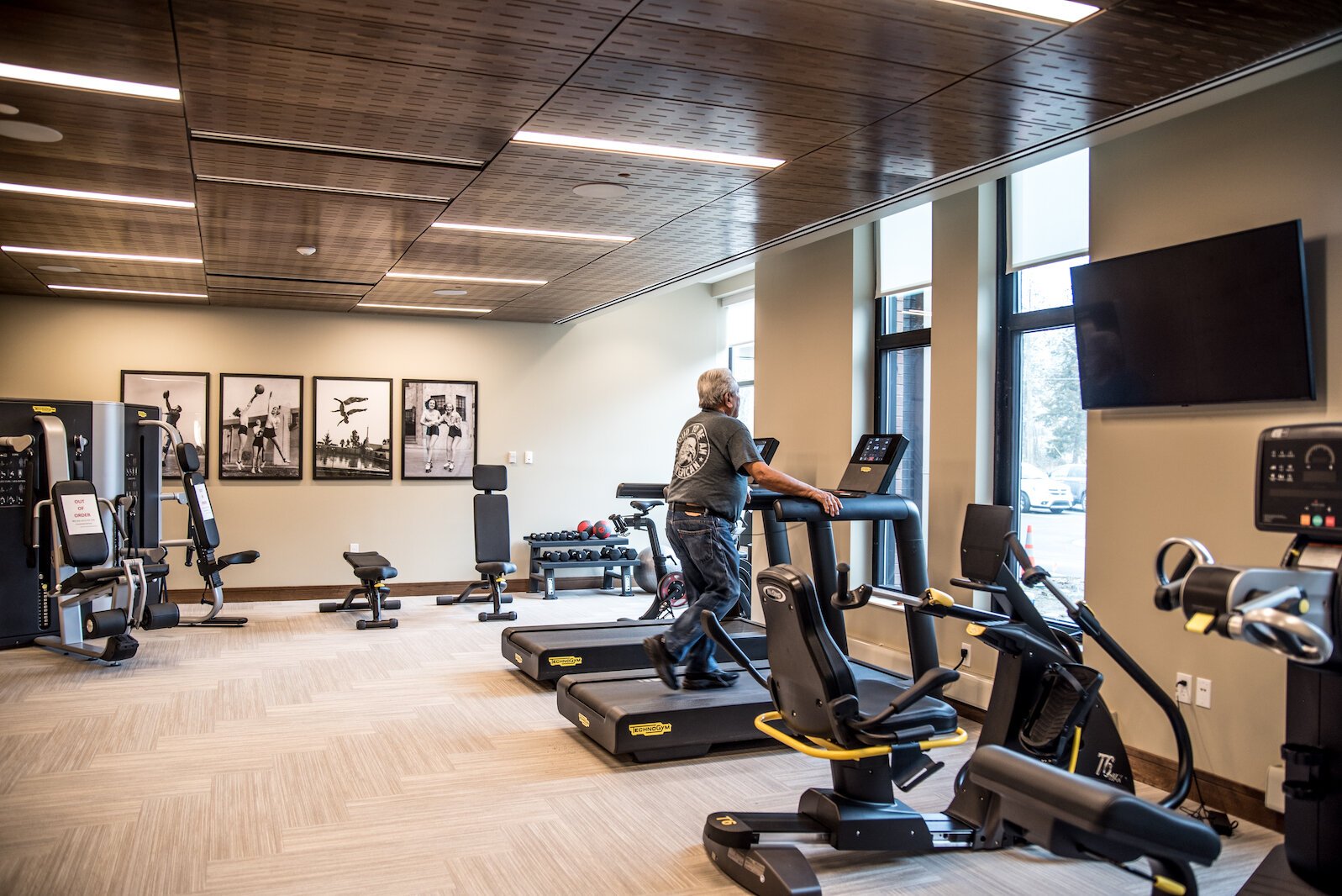 Among the amenities covered by monthly fees at Revel Creek is the use of a ground-floor fitness center, wellness programs and social, educational, and recreational activities.