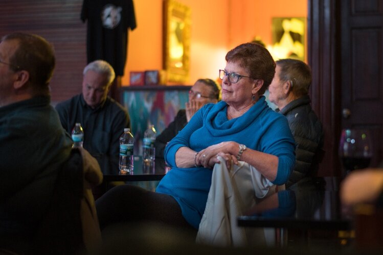 Mrs. Chuck Vliek watches the festivities Tammy Taylor at the retirement gathering saluting Tammy Taylor for her years as executive director of the Edison Neighborhood Association 