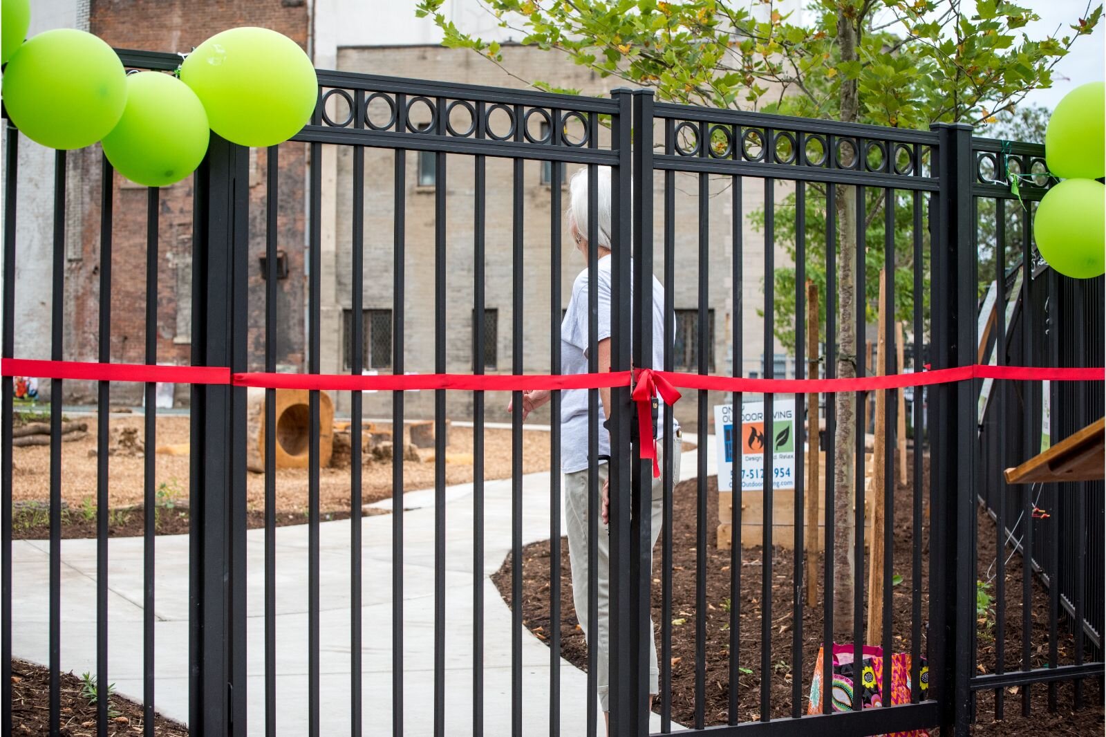 The gates were sybolically secured by a red ribbon.