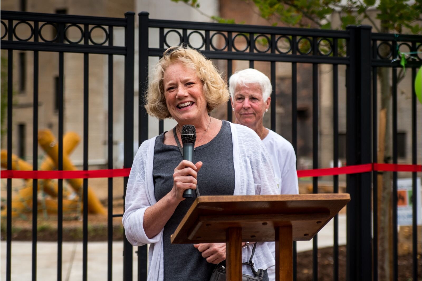  Sandy Bleisener, Principal at OCBA Landscape Architects, offers remarks at the grand opening of Children’s Nature Playscape at Bronson Park.