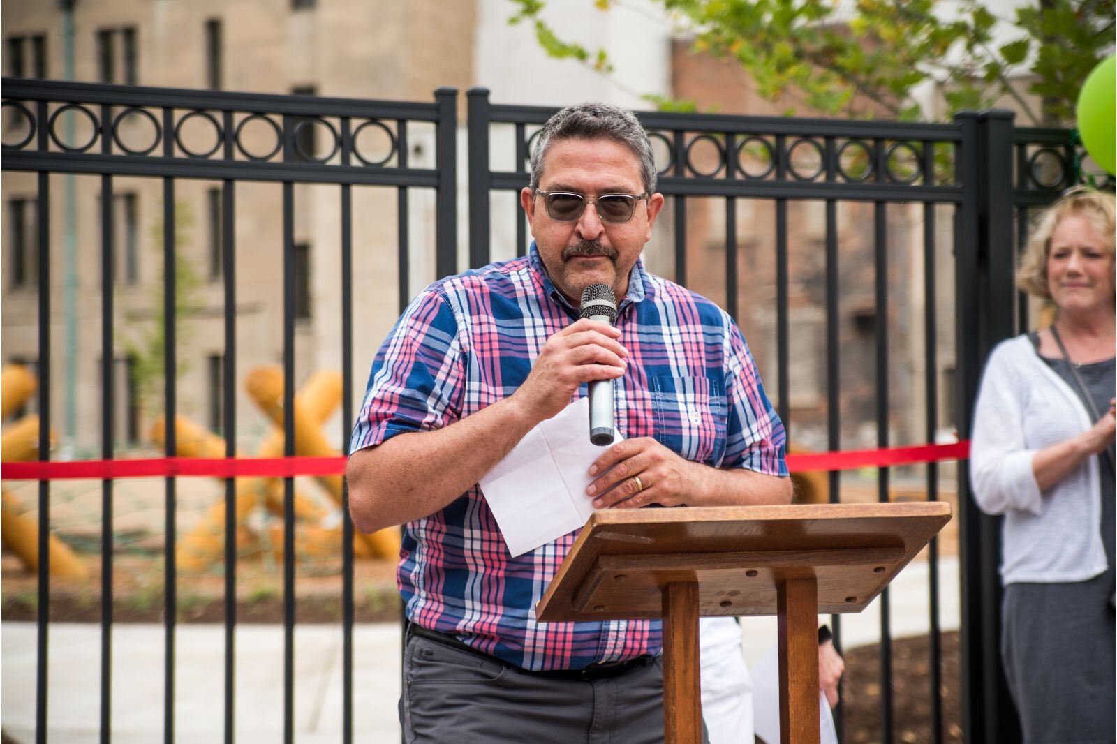 Howard Tejchma, Moderator for First Congregational Church,  offers remarks at the grand opening of Children’s Nature Playscape at Bronson Park. The church’s initial funding made it possible to purchase the property and begin the planning phase.