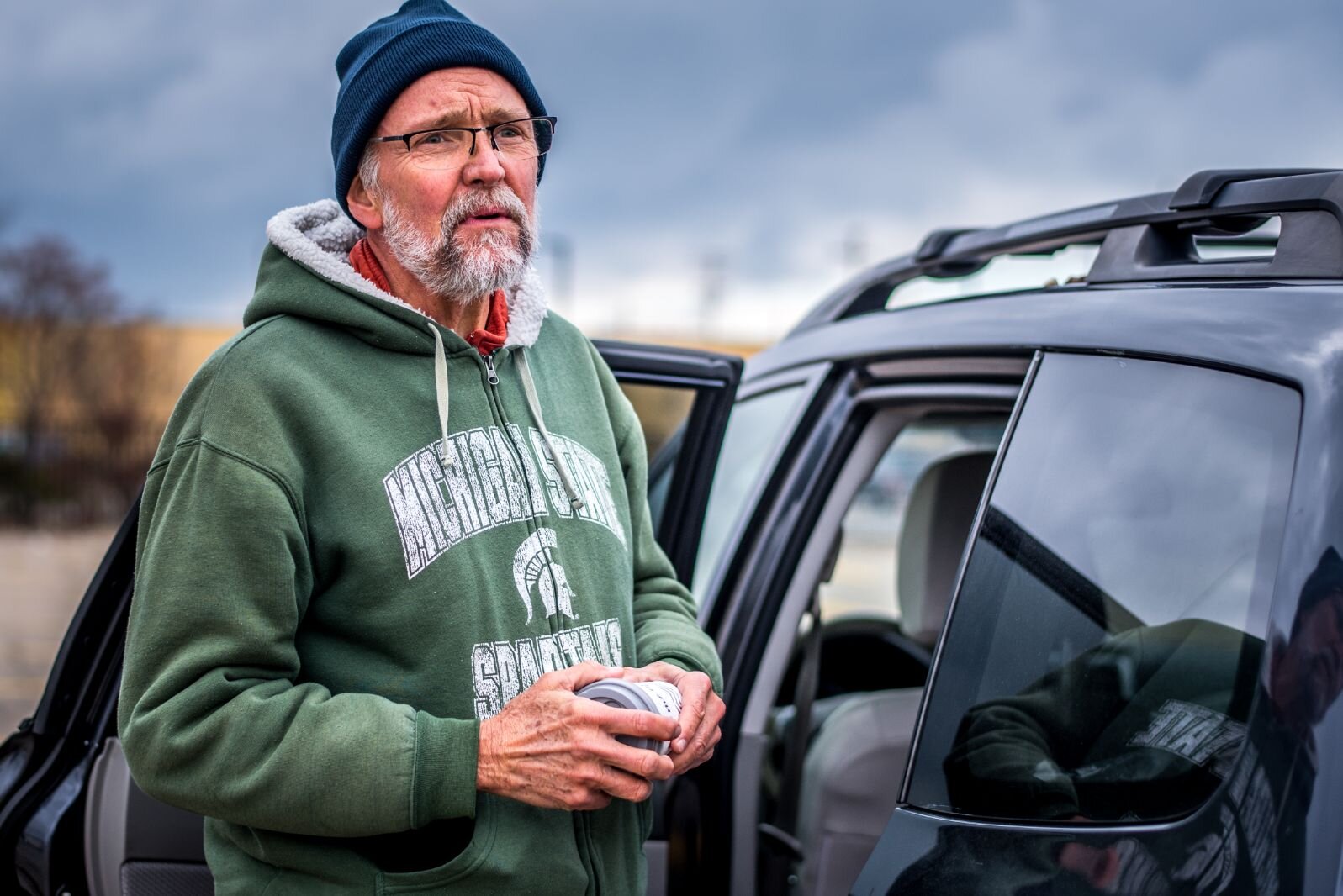 Out in the parking lot of Wallbridge St. church The River, Jan van Schaik warns people who might not have access to a weather forecast that a storm is coming. The following weekend saw feet of snow, night temperatures in the teens.