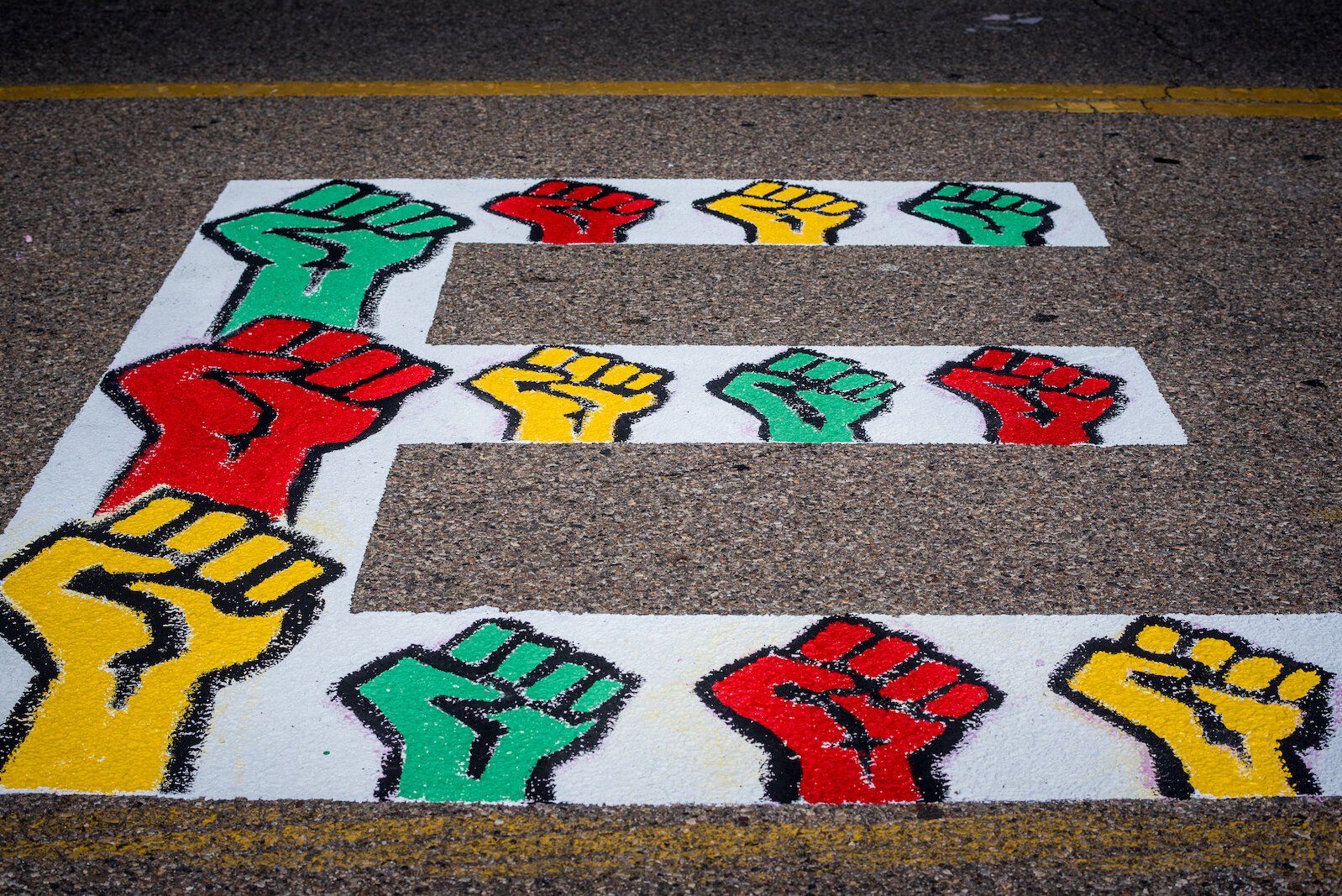 A part of  the creation of the Black Lives Matter mural on Rose Street, between Lovell and South streets painted on Friday afternoon.