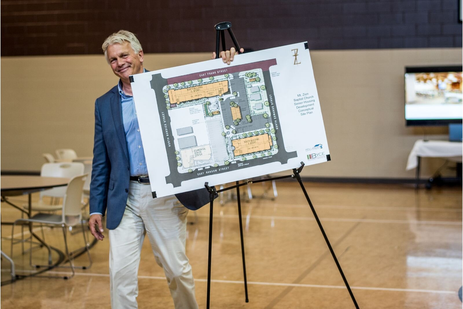 Michael Flynn, of Byce & Associates architectural and engineering firm, presents a rendering on July 21, 2022, of a 70-unit senior housing complex that is planned for the 100 block of East North Street.