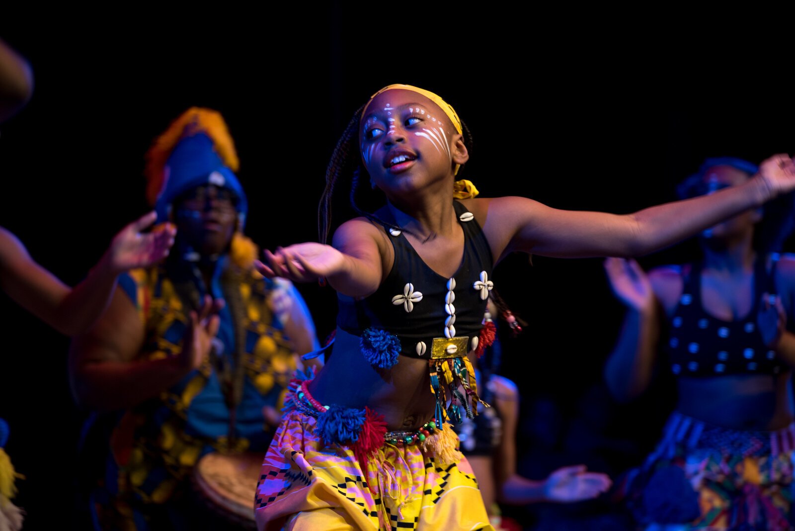 This photo was taken at the Rootead Youth Drum & Dance Ensemble (RYDDE) Showcase in December 2023. "It was a joyous event," says photographer Fran Dwight, "and then these girls came out and they were just smiling and having the time of their lives."