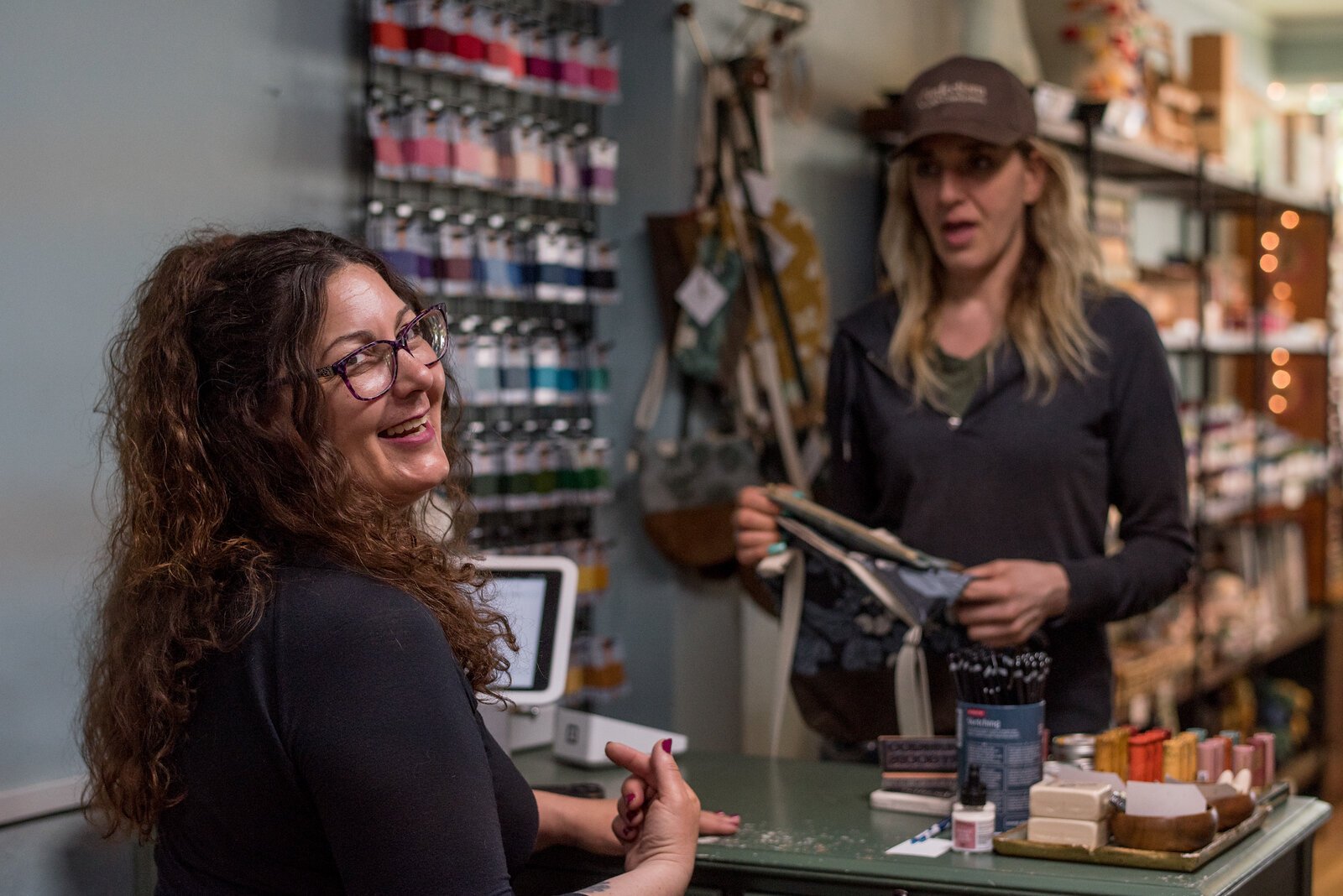 Rebecca Macleery, owner of Kalamazoo Dry Goods, and sister Jennifer Faketty, owner of Confections with Conviction, frequently visit  each other's stores.
