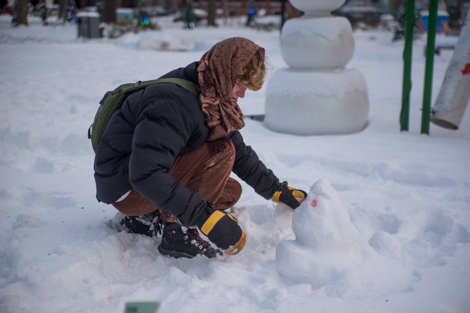 Students built mini snowpeople throughout Bronson Park and on the steps of City Hall.