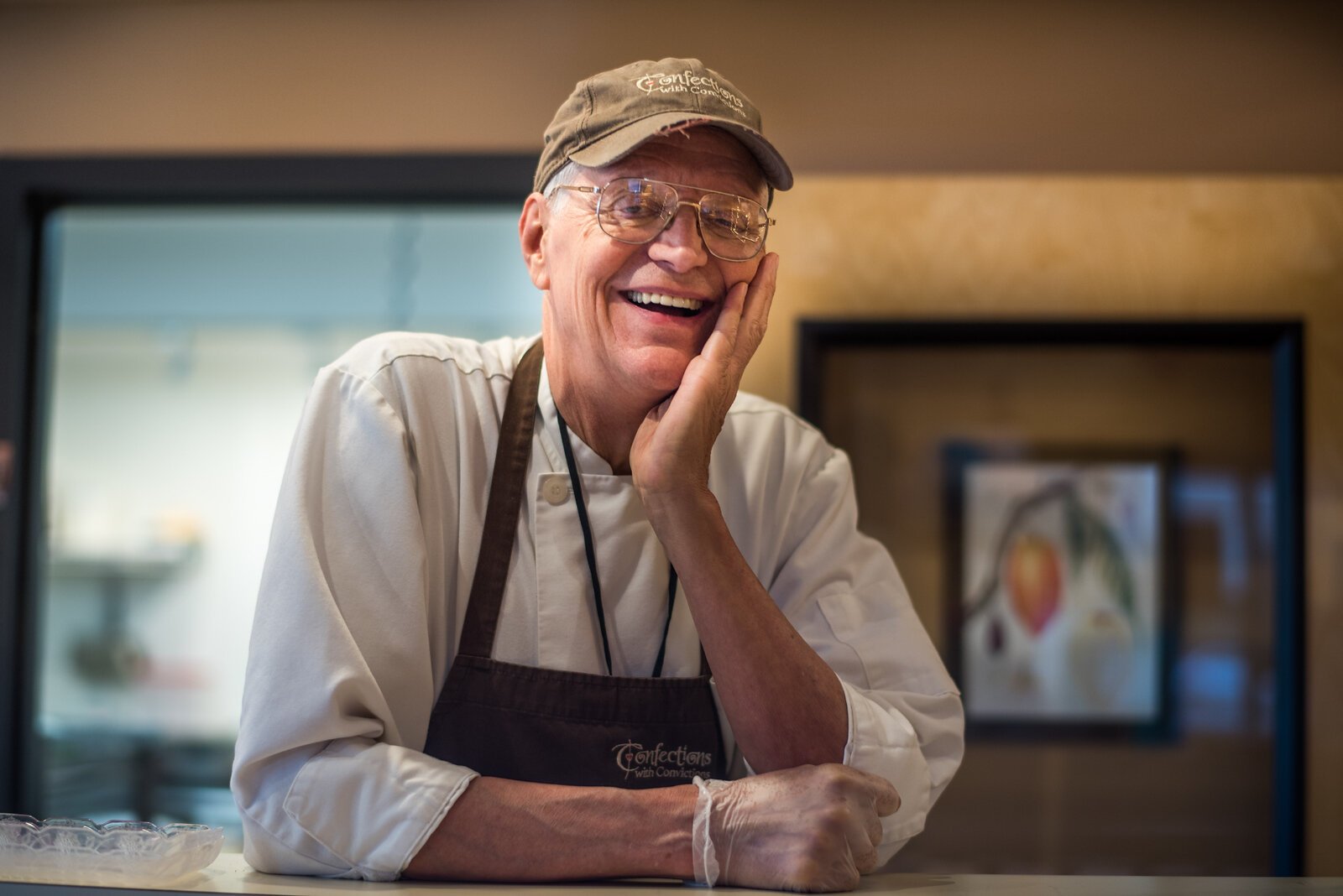 Dale Anderson, founder and former owner of Confections with Convictions, continues to work at the shop under its new ownwership.