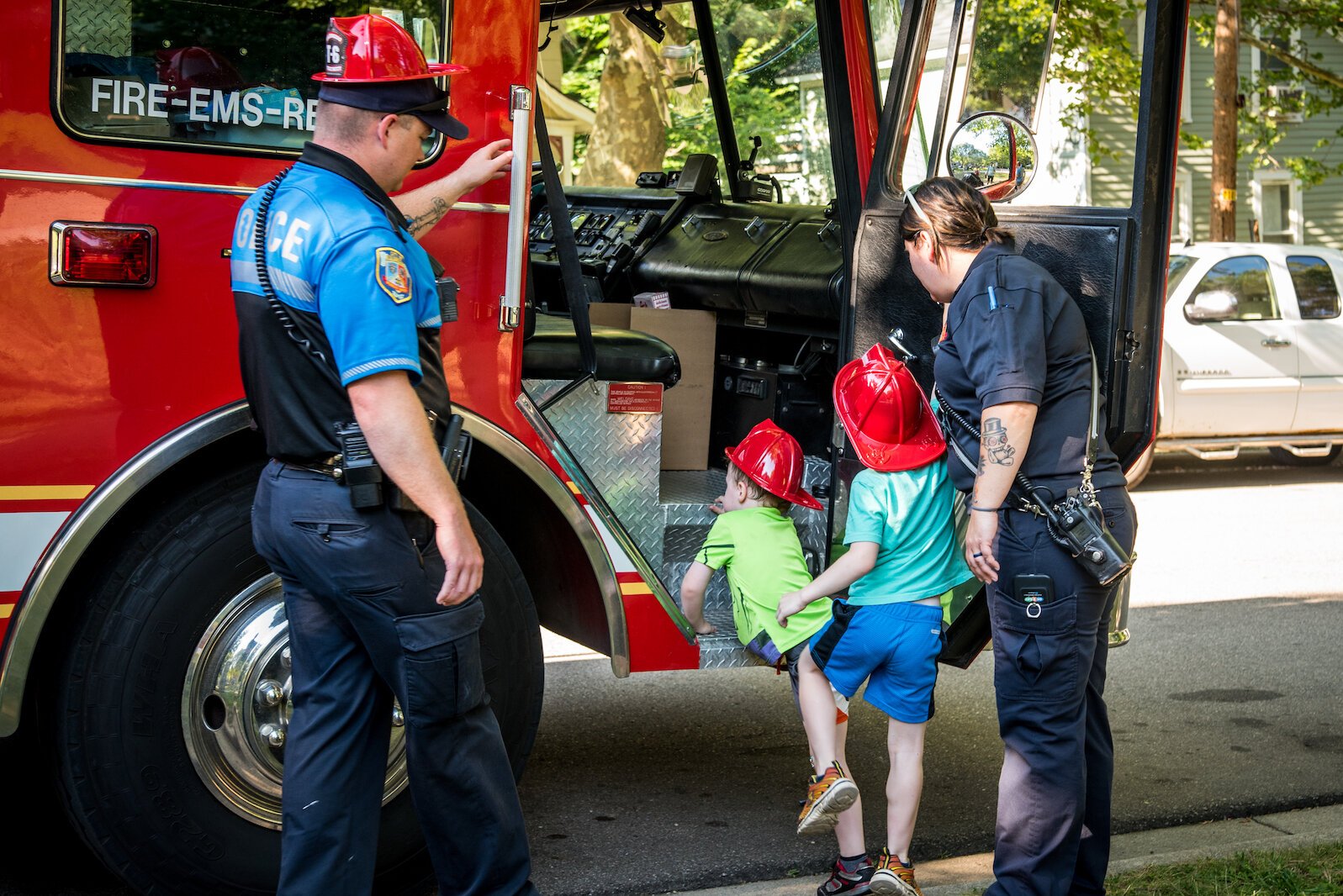 The KDPS fire trucks drew little ones the Vine Neighborhood celebration of National Night Out.  Photo by Fran Dwight