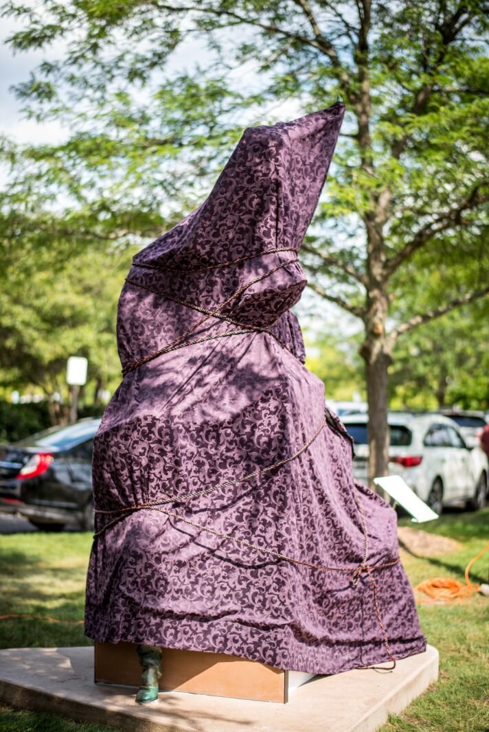 A deep purple covering hides the sculpture until it was time for its unveiling outside Bronson Methodist Children’s Hospital.