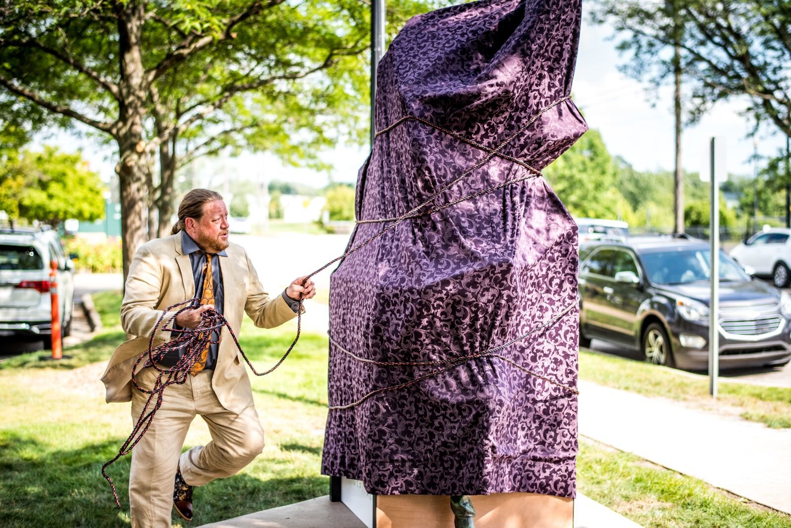 Kalamazoo sculptor Joshua Diedrich unveils the artwork he created now standing outside Bronson Methodist Children’s Hospital.