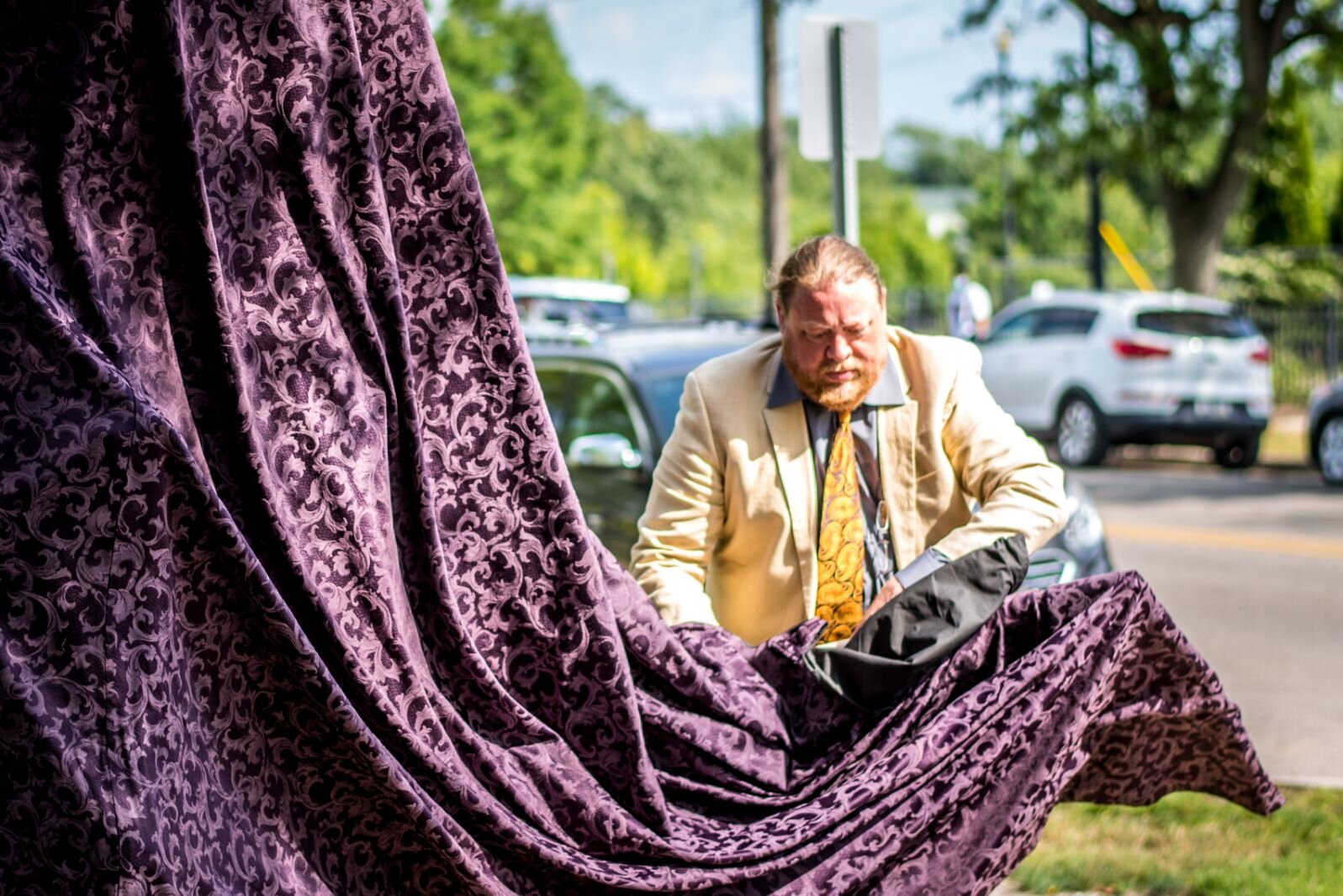 Kalamazoo sculptor Joshua Diedrich unveils the artwork he created now standing outside Bronson Methodist Children’s Hospital.