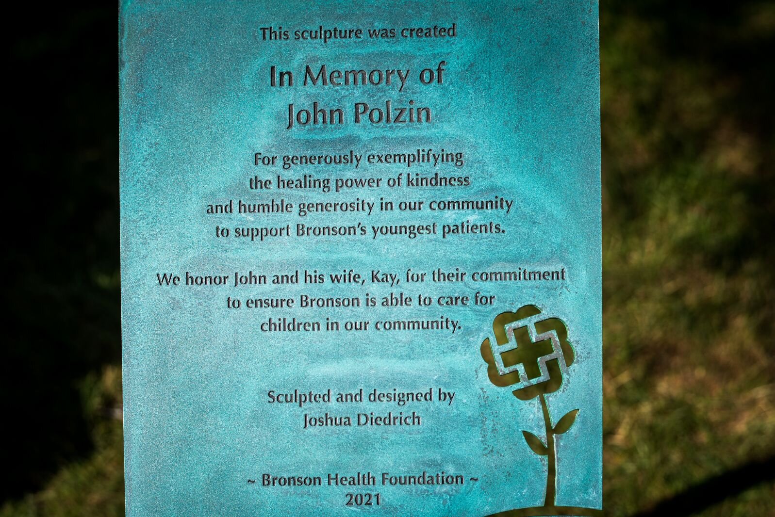 This sculpture was created in memory of John Polzin for his commitment to  Bronson Methodist Children’s Hospital.