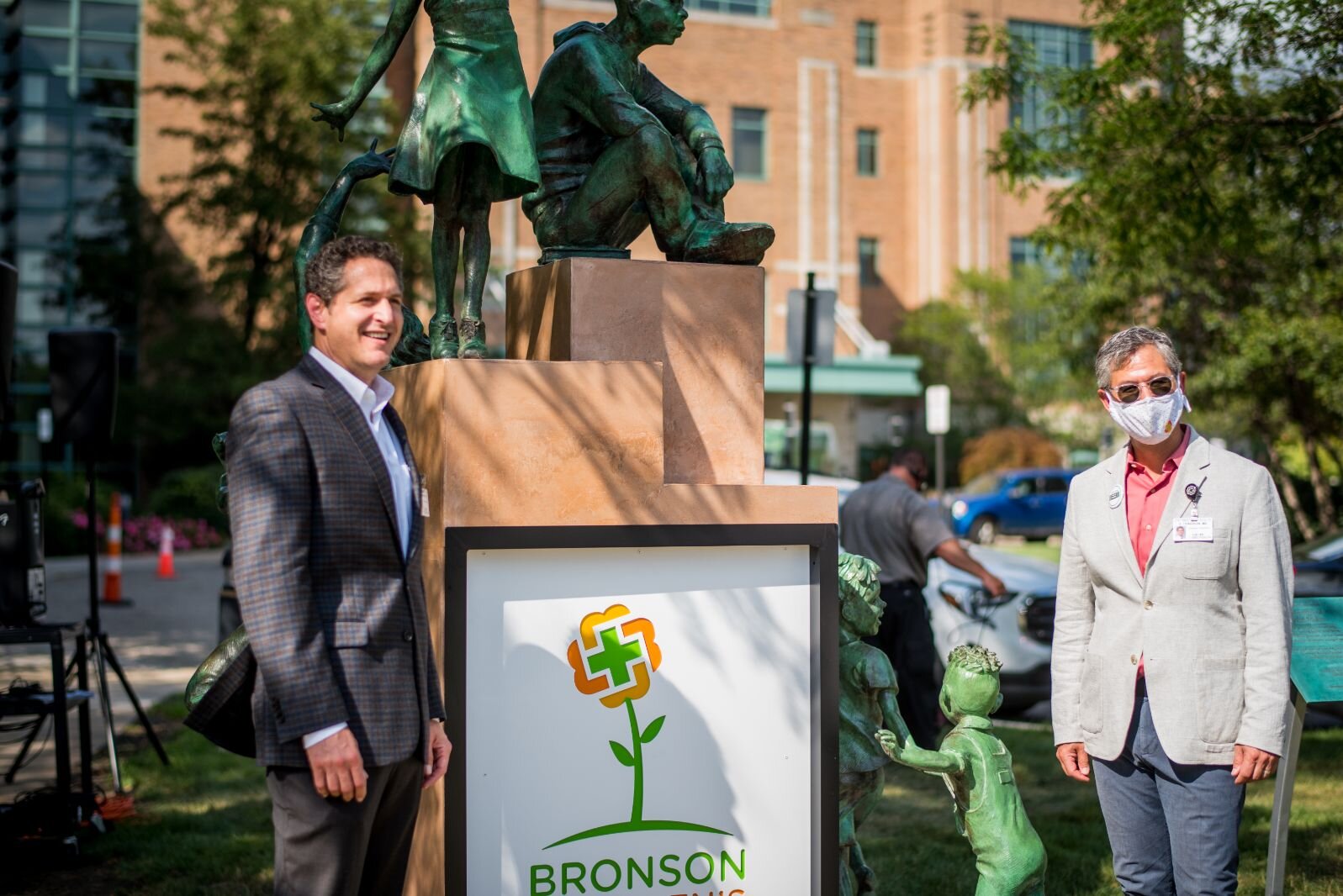 Guests stand next to the sculpture outside Bronson Methodist Children’s Hospital.