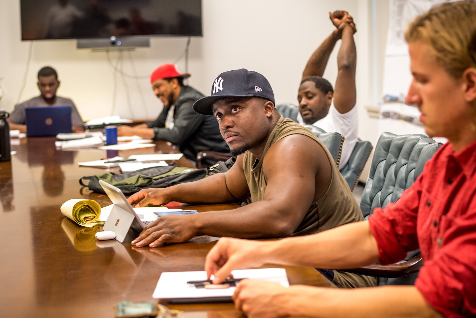 Jamuari Bogan, a developer who has become involved in a few local projects, considers the conversation during a session of the Core 60 training program.