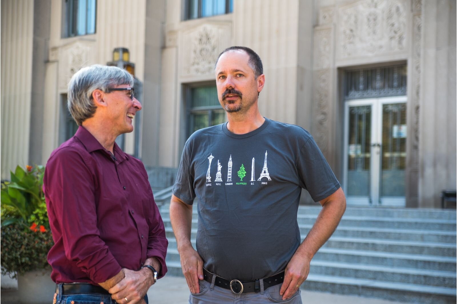 WMU professor Paul Clements and Jeff Spoelstra (Elliot's father) chat near the steps of City Hall.