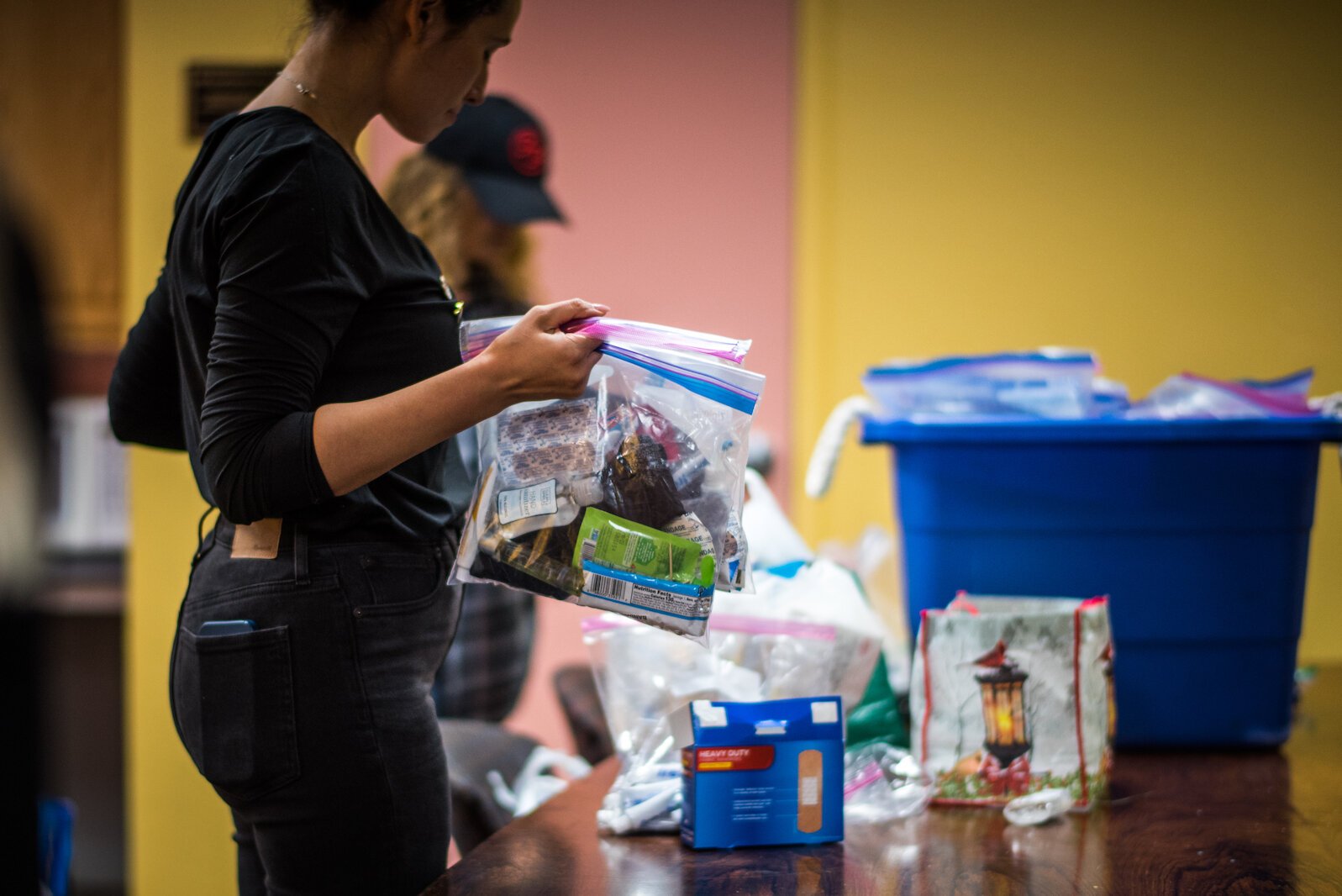 The Edison Neighborhood Association donated its facilities for the day as United for the Unsheltered and Global Ties Kalamazoo along with visiting Romanian aid workers worked together to help make food and care packages for Kalamazoo's homeless.