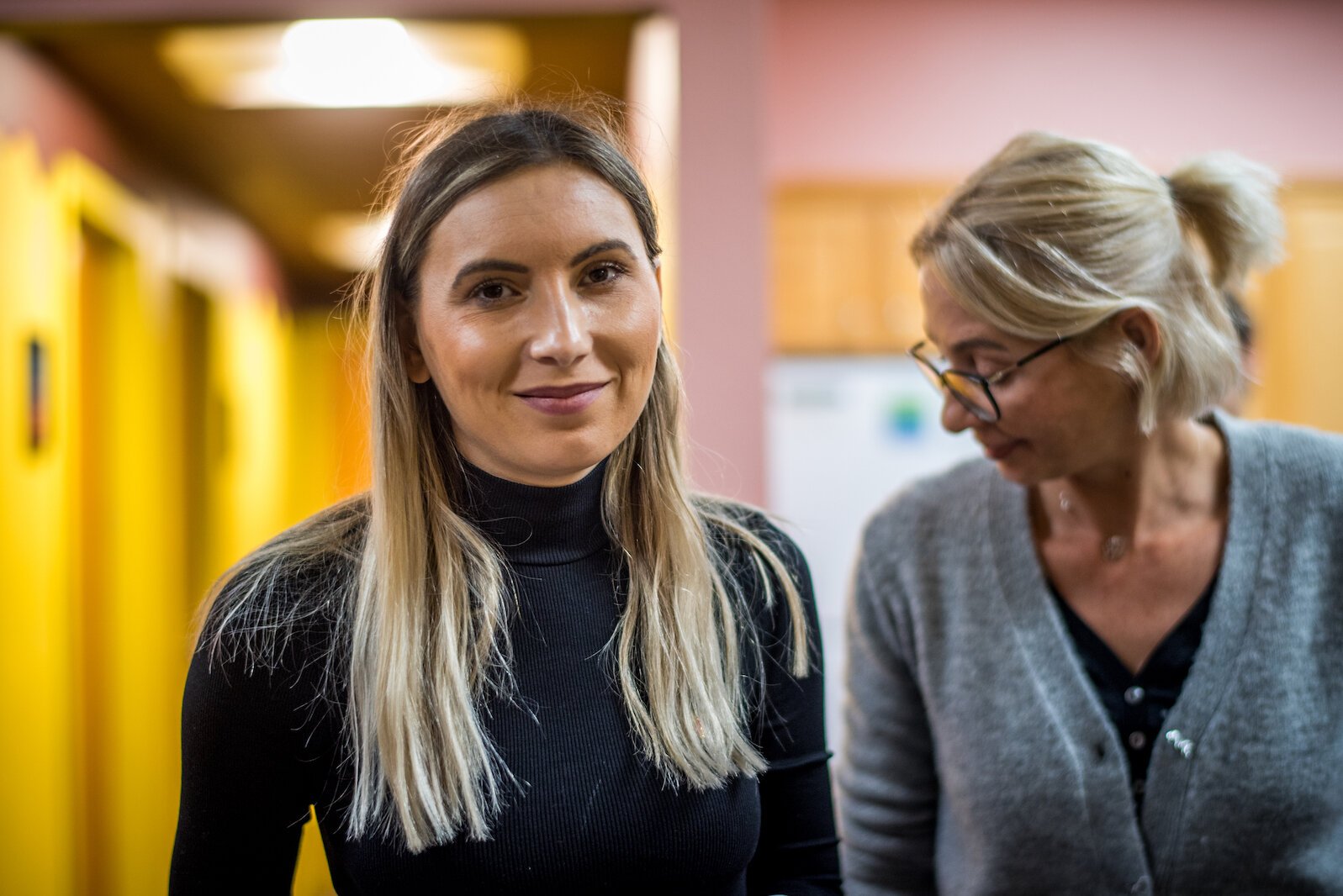 Visiting Romanian aid workers, who this year have been working with Ukrainian war refugees help with food and care packages for Kalamazoo's homeless.