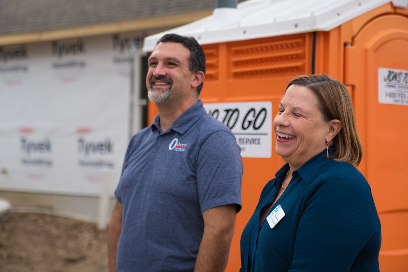Beth McCann, of KNHS, right, shares a laugh on Tuesday, Oct. 25, 2022 with Kevin Osborne, owner of Osborne Construction & Maintenance LLC. He is the builder of the 203-205 Wall Street duplex.