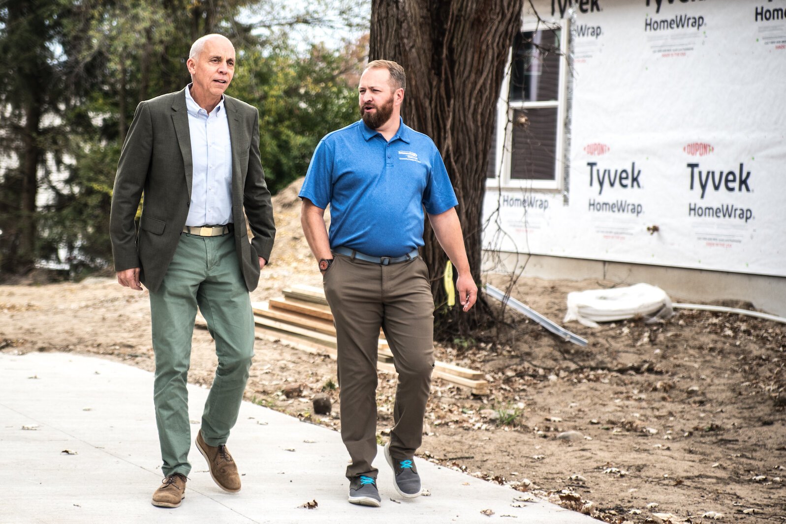 Kalamazoo Mayor David Anderson, left, talks about energy efficiency as he walks the redeveloped property on Wall Street at South Rose Street on Tuesday, Oct. 25, 2022 with Derek Nofz, community affairs manager for Consumers Energy.