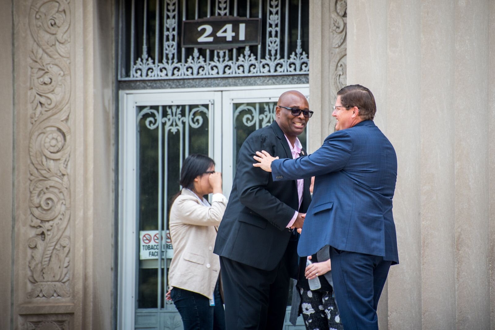 Department of Public Safety Chief Vernon Coakley Jr. and City Manager Jim Ritsema greet one another before a press conference to announce a $400 million donation to the Foundation for Excellence.