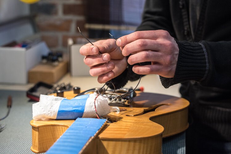  The craftsmen at Kal-Tone Musical Instruments Co. do repair work on acoustic and electric guitars, mandolins, banjos and other stringed instruments.