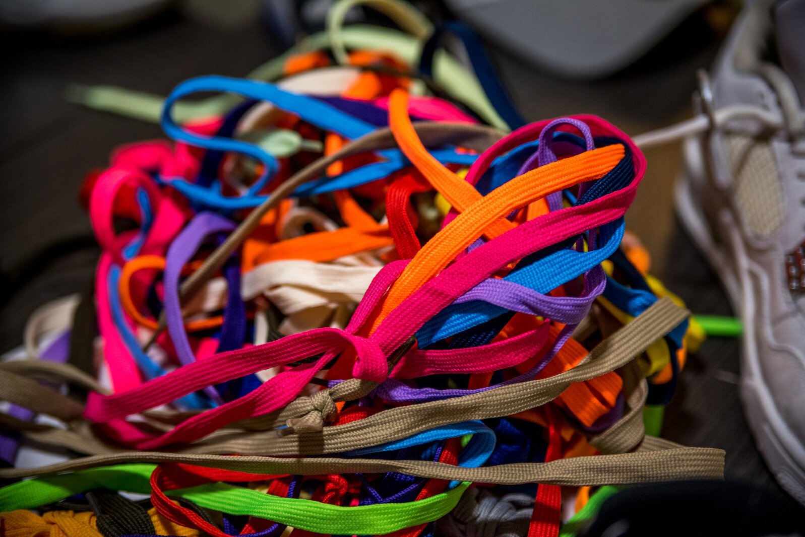 Roosevelt Lee-Fleming learned to clean and restore sneakers as a teen. He keeps a colorful array of shoelaces as part of that.