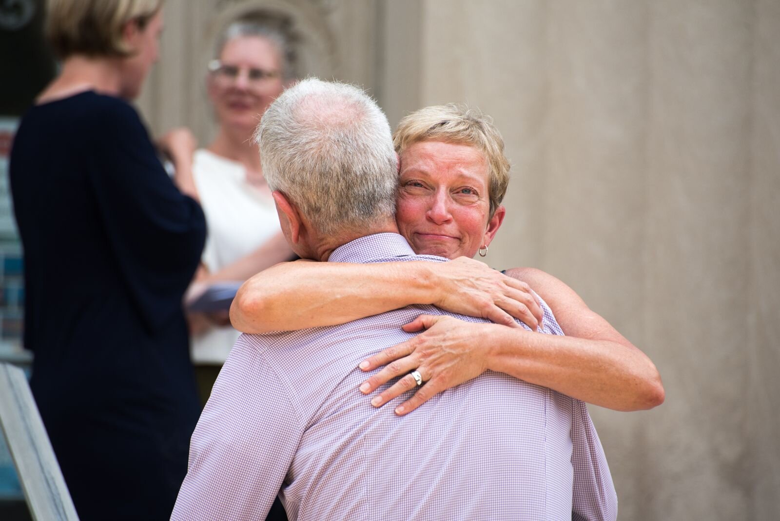 City Commissioner Jeanne Hess gives a hug to one of those in attendance at a press conference to announce a $400 million donation to the Foundation for Excellence.