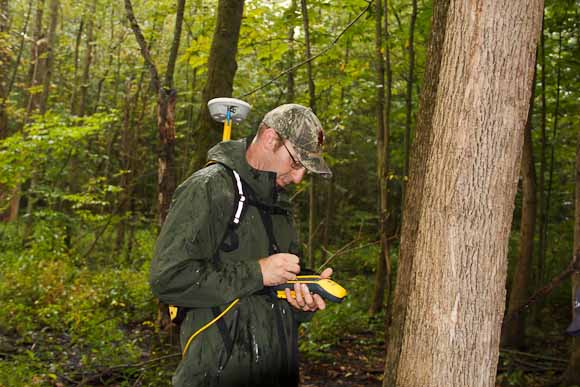 Vic Bogosian, natural resources manager records location data from antenna in backpack