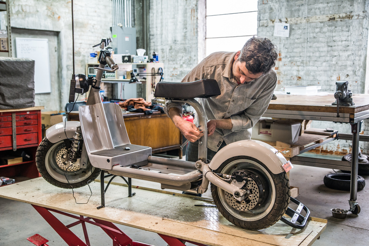 Jeb Gast at work at Fido Motors.  Photo by Fran Dwight.