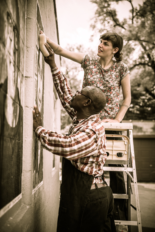 Hanging the photos for "We Are Edison" Photo by Fran Dwight