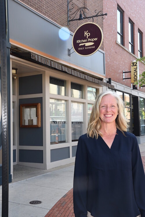 Kelly Hoffrman of Northern Initiatives, in front of Kitchen Proper in downtown Battle Creek.