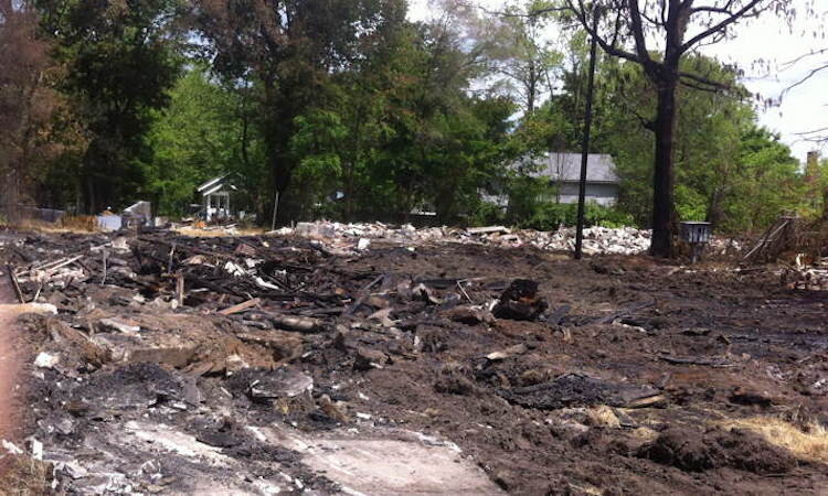 The burned remains of the houses were quickly demolished.