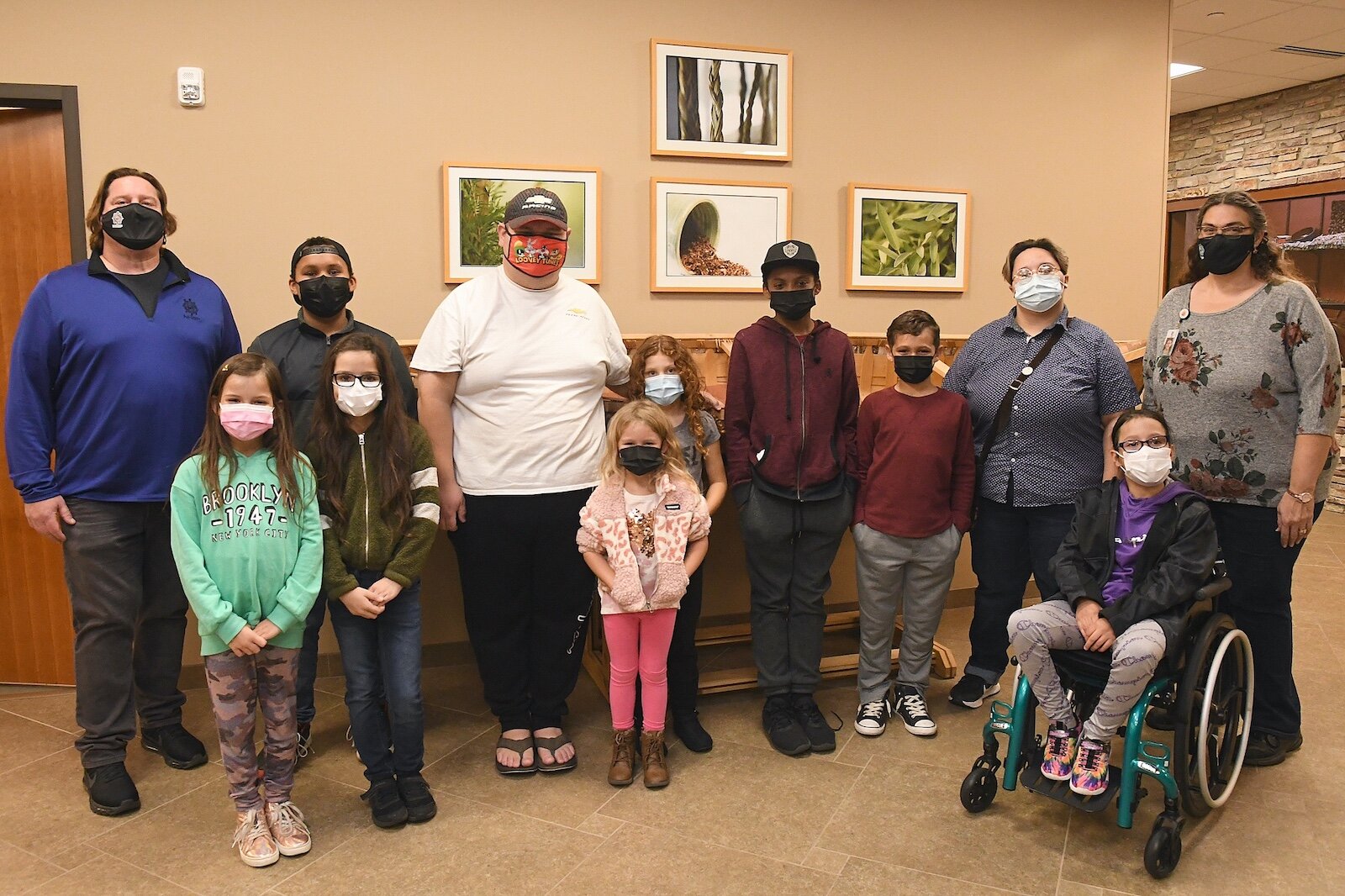 Jamie Stuck, far left, and Michelle Simms, far right, are seen with members of the Tribal Youth Program of the Nottawaseppi Huron Band of the Potawatomi.