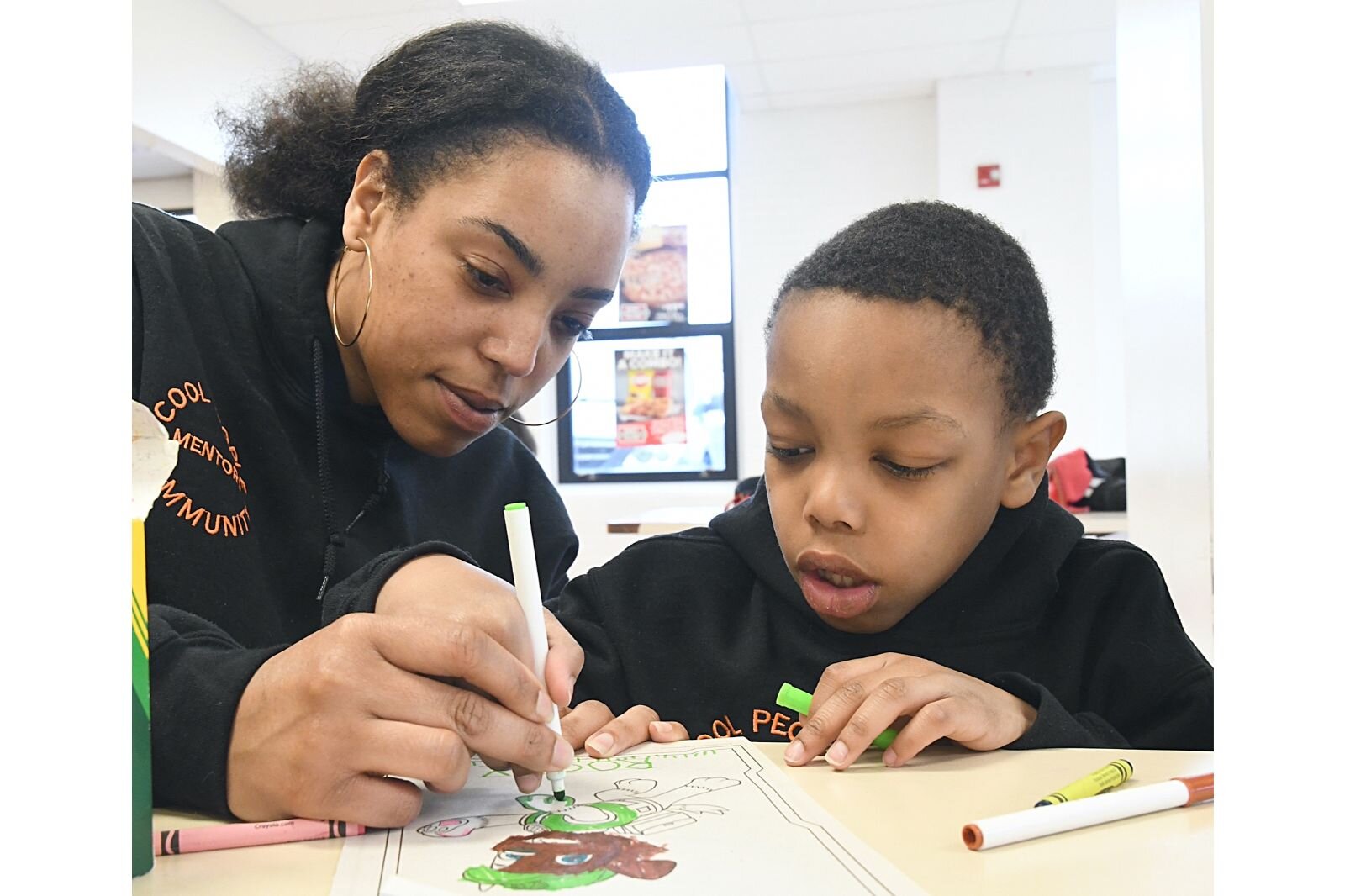 Brook-Lyn Glass, left, works with Braylen Lee during a Cool People after-school session at Kingdom Builders.