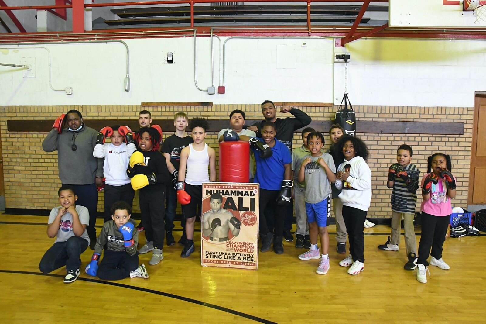 Members of the Still Hope Boxing Gym, a group Cool People works with, pose for a photo at Kingdom Builders.